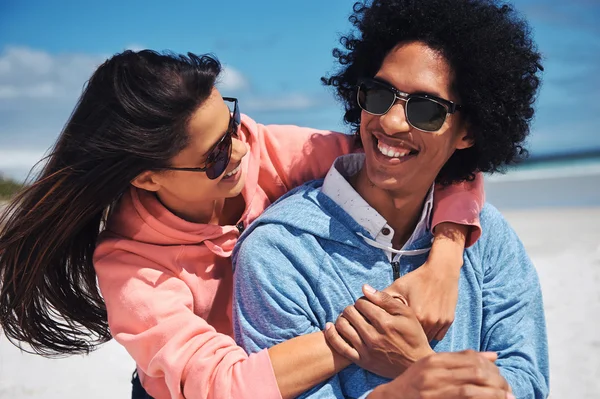 Latino couple at the beach embracing — Stock Photo, Image