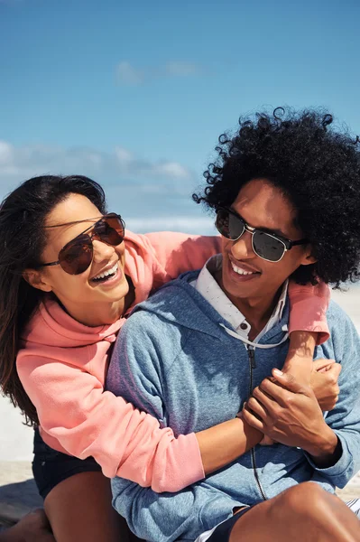 Latino couple at the beach embracing — Stock Photo, Image