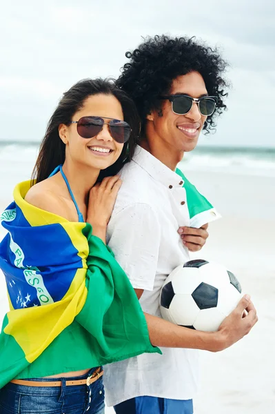 Couple with Brasil flag and ball — Stock Photo, Image