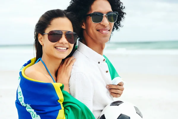 Couple with Brasil flag and ball — Stock Photo, Image