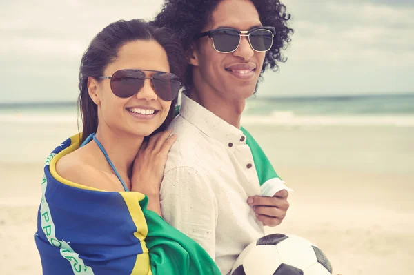 Couple with Brasil flag and ball — Stock Photo, Image
