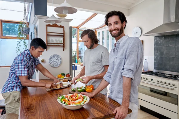 Friends helping with salad snacks — Stock Photo, Image