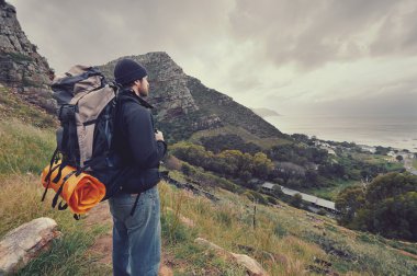man hiking wilderness mountain with backpack clipart