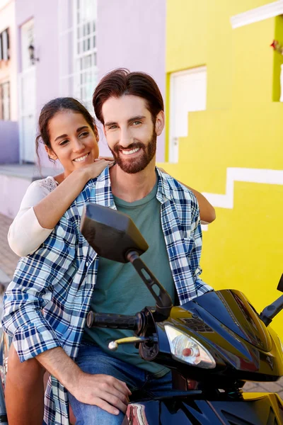 Happy couple on a scooter — Stock Photo, Image
