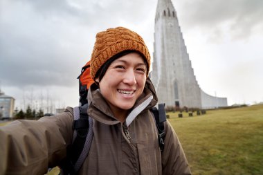 portrait of woman with church background