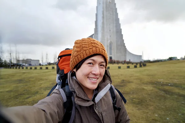 Portrait of woman with church background — Stok fotoğraf