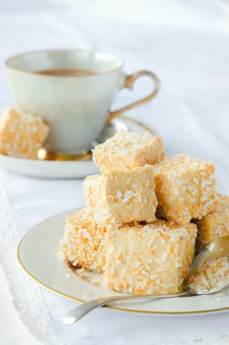 Golden marshmallow cubes with coconut bits