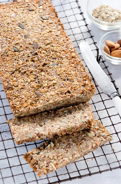 Healthy loaf of bread full of different seeds and nuts — Stock Photo, Image