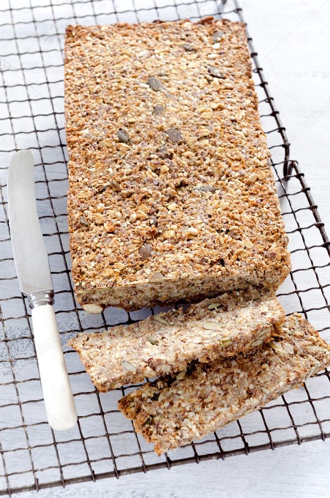 Healthy loaf of bread full of different seeds and nuts 