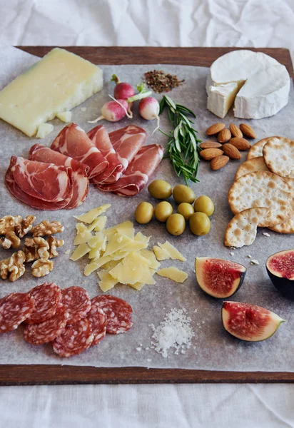 Charcuterie board with cheese — Stok fotoğraf