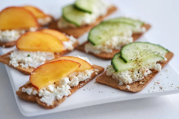 Ricotta cheese with peach and cucumber — Stock Photo, Image