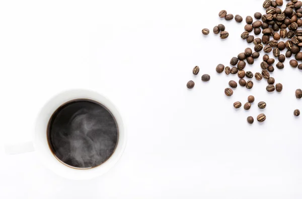 Cup of coffee with beans — Stock Photo, Image