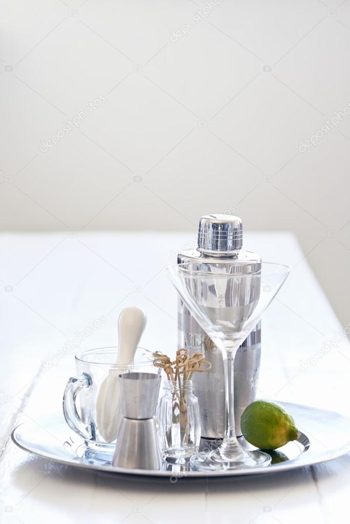 Silver tray with martini glass and cocktail