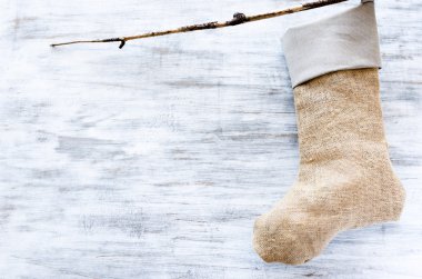 Handmade christmas stocking made of hessian and cloth