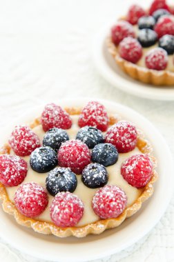 Pair of tarts with icing sugar