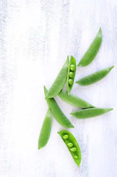 Peas on rustic background — Stock Photo, Image