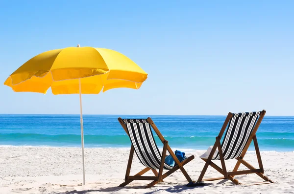 Beach chairs on sand — Stock Photo, Image