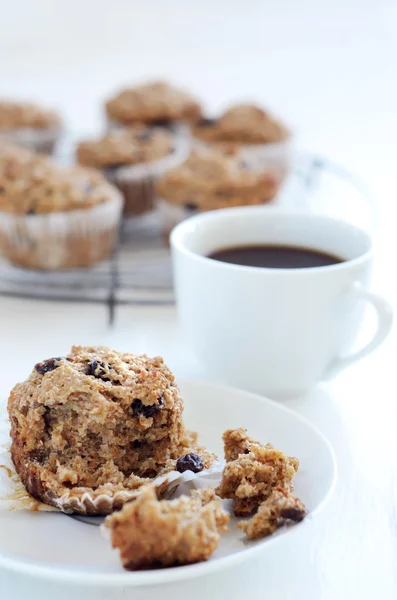 Half eaten bran muffin — Stock Photo, Image