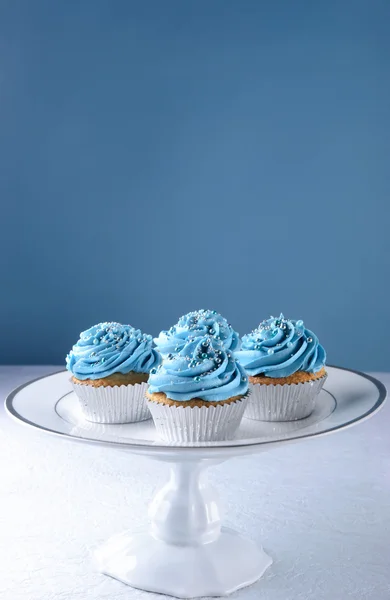 Blue cupcakes with silver decorations — Stock Photo, Image