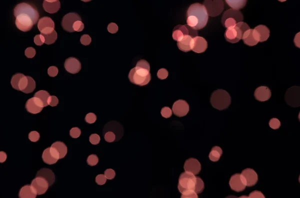 Pink bokeh on black background — Stock Photo, Image