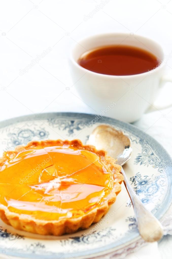 tart served with a cup of tea