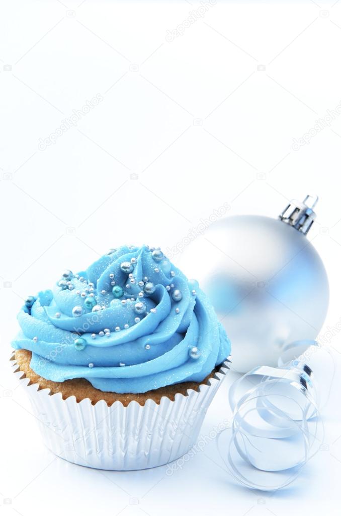 cake with christmas bauble and ribbon