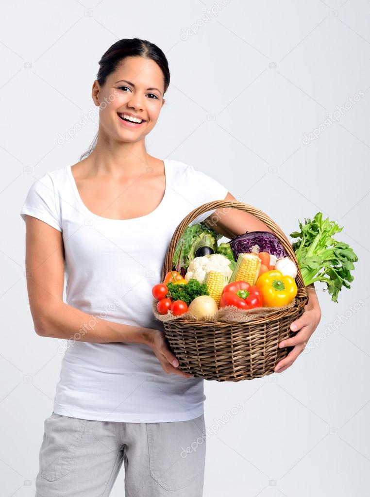 Happy woman with freshly harvested produce