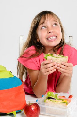 Healthy packed lunch box for elementary school girl clipart