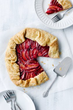 Baking plum galette, a rustic french dessert pie