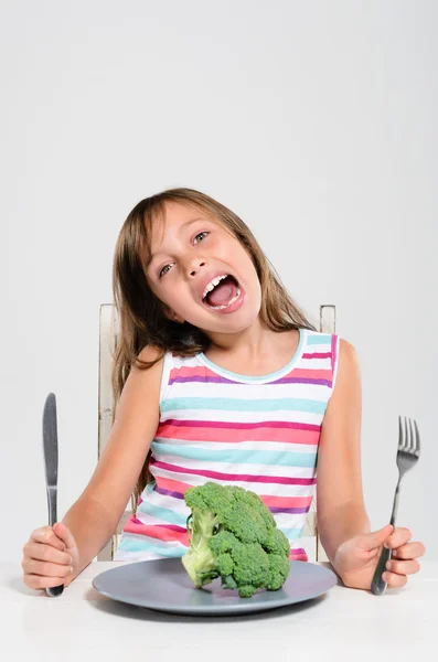 Girl happy at meal time — Stock Photo, Image