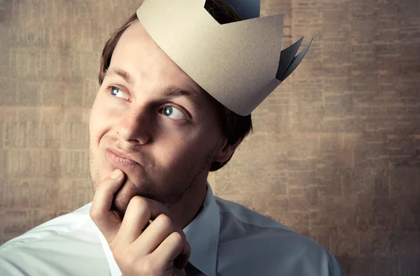 Leader with crown daydreaming — Stock Photo, Image