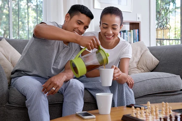 Husband pouring coffee — Stock Photo, Image