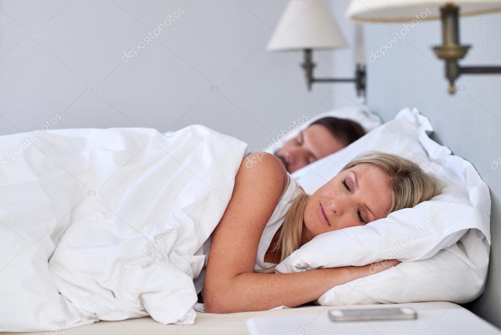 Caucasian couple sleeping