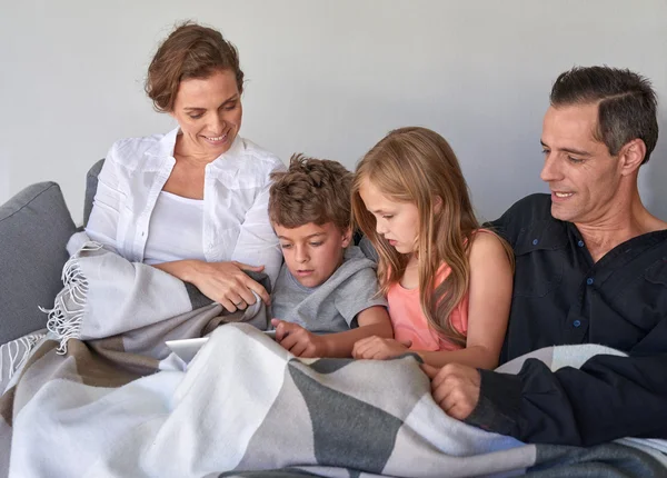 Family playing with digital touchpad at home — Stock Photo, Image