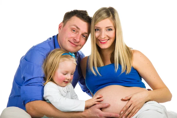 Pregnant mother, father and preschool daughter on white — Stock Photo, Image