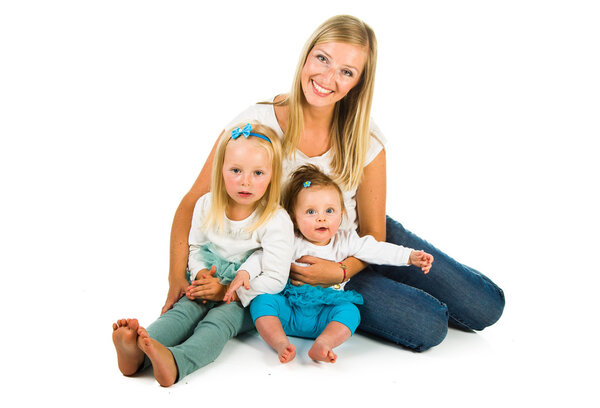 Mother with two daughters: preschool and newborn