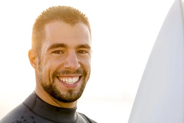 Handsome young surfer smiling. — Stock Photo, Image