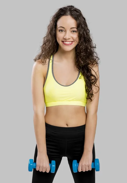 Woman doing exercises with dumbbells — Stock Photo, Image