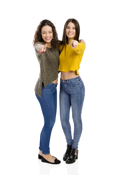 Girls pointing and looking to the camera — Stock Photo, Image