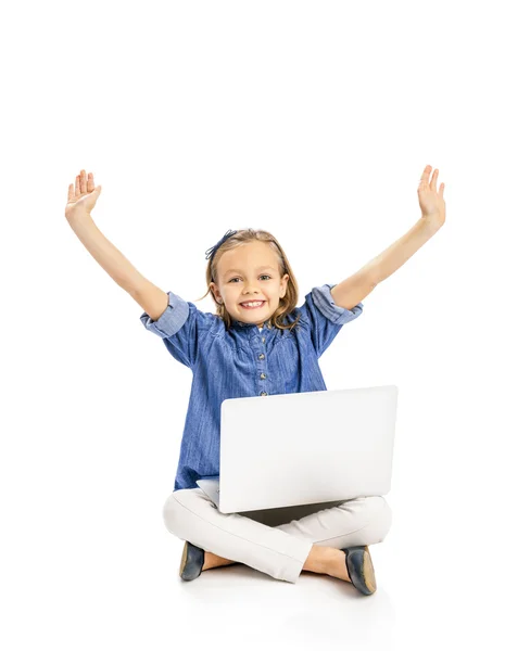 Little girl working with a laptop — Stock Photo, Image