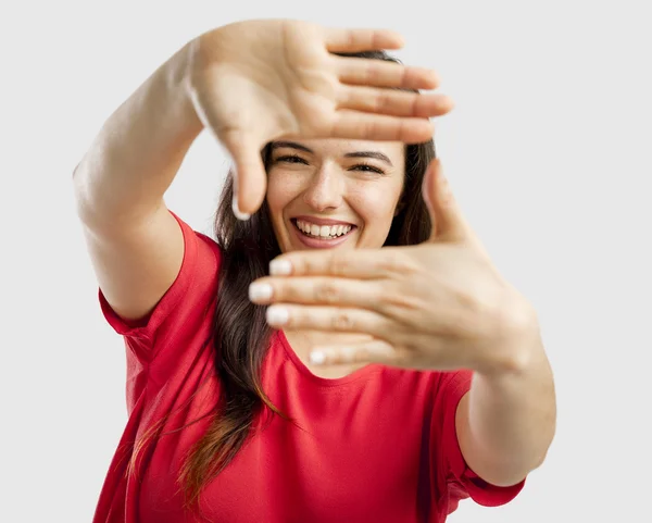 Mujer encantadora enmarcando su cara —  Fotos de Stock