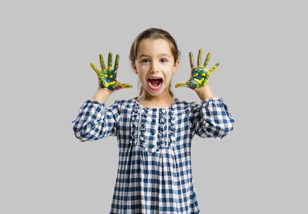 Little girl with hands in paint — Stock Photo, Image
