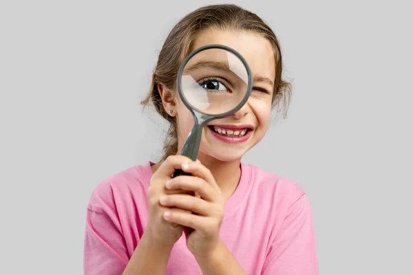 Looking through a magnifying glass — Stock Photo, Image