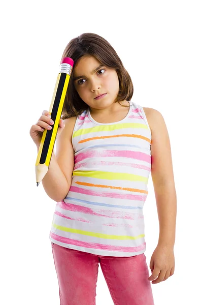 Girl holding a big pencil — Stock Photo, Image