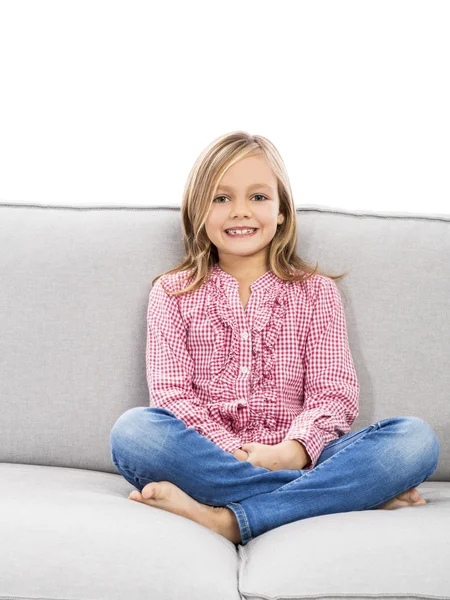 Girl on couch and looking to camera — Stock Photo, Image