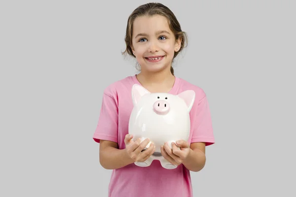 Chica sosteniendo un piggybank —  Fotos de Stock