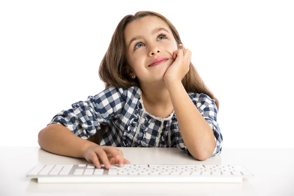 Little girl working with a computer — Stock Photo, Image