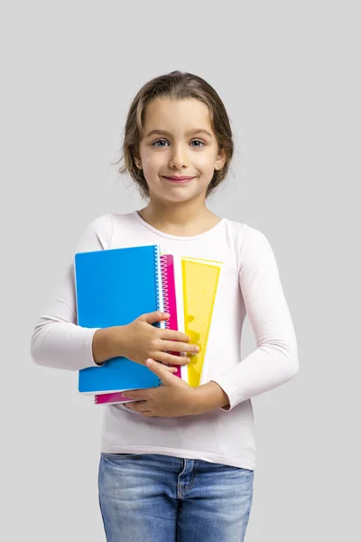 Studente ragazza tenendo quaderni — Foto Stock