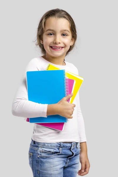 Studente ragazza tenendo quaderni — Foto Stock