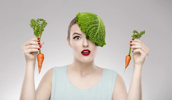 Woman with a cabbage on the head — Stock Photo, Image